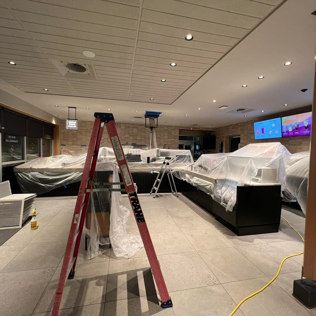 A large room with a ladder that says trade on it