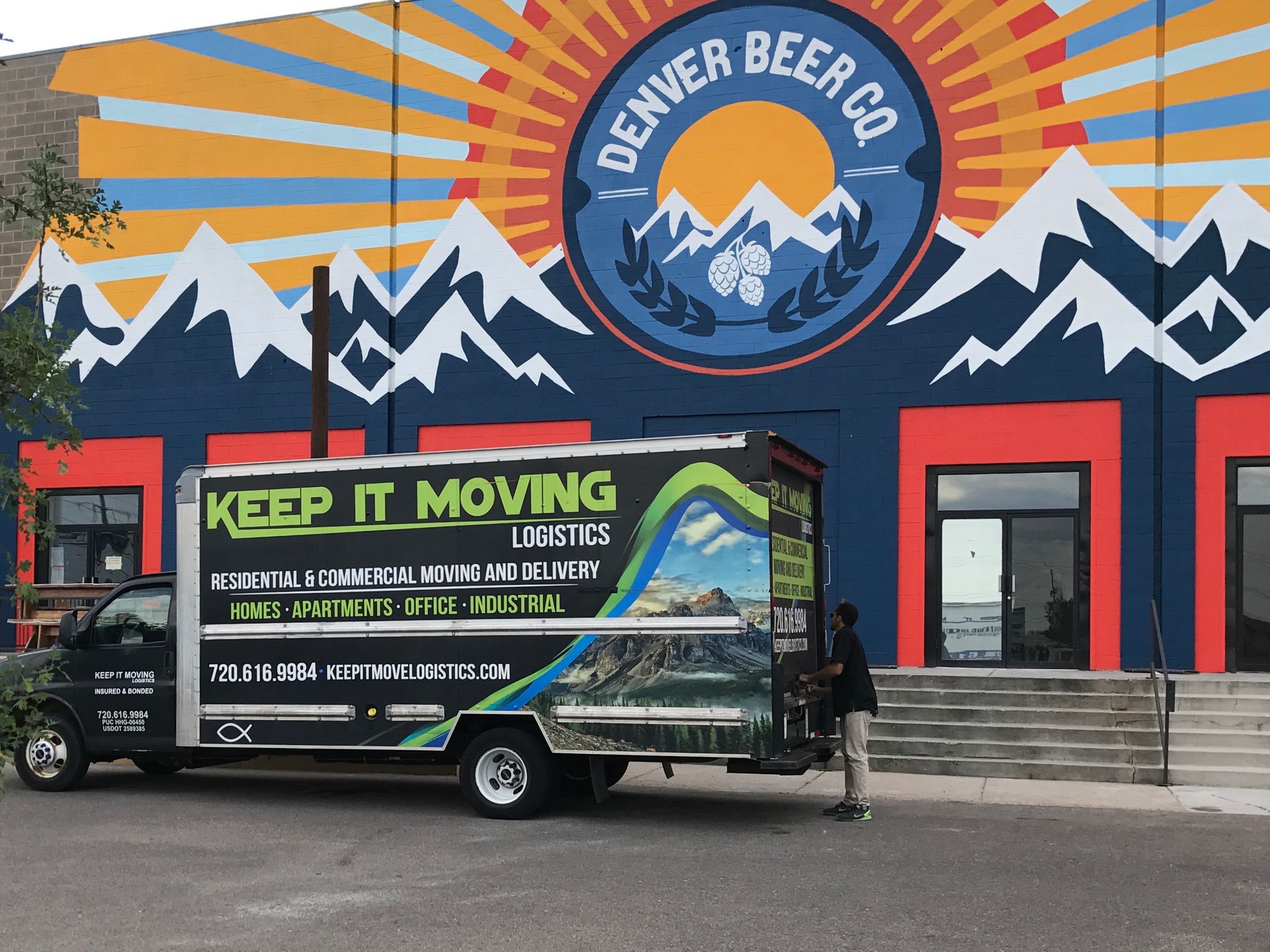 a keep it moving truck is parked in front of a house