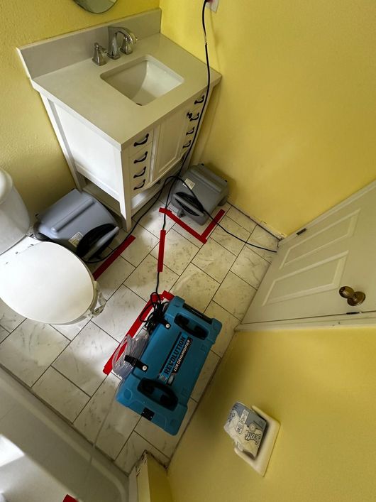 An aerial view of a bathroom with a sink and toilet