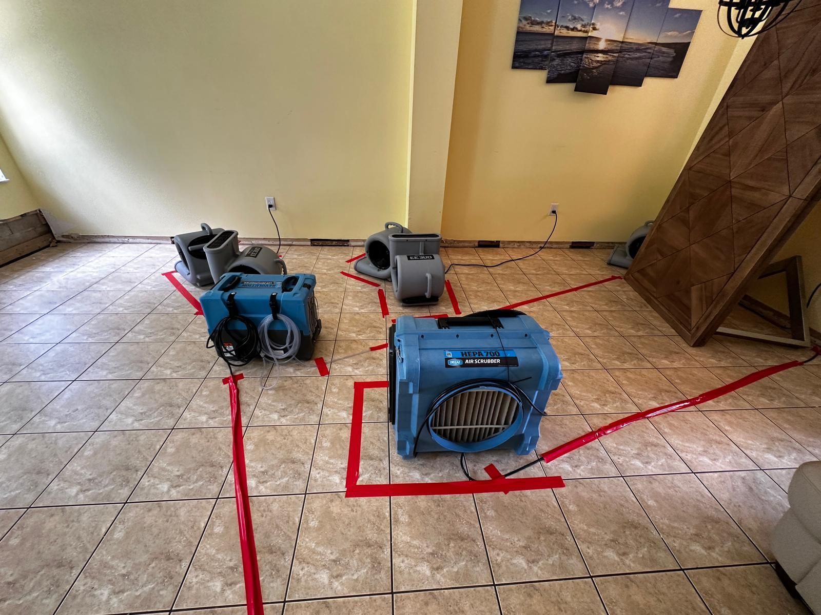 A room with a lot of appliances on the floor.
