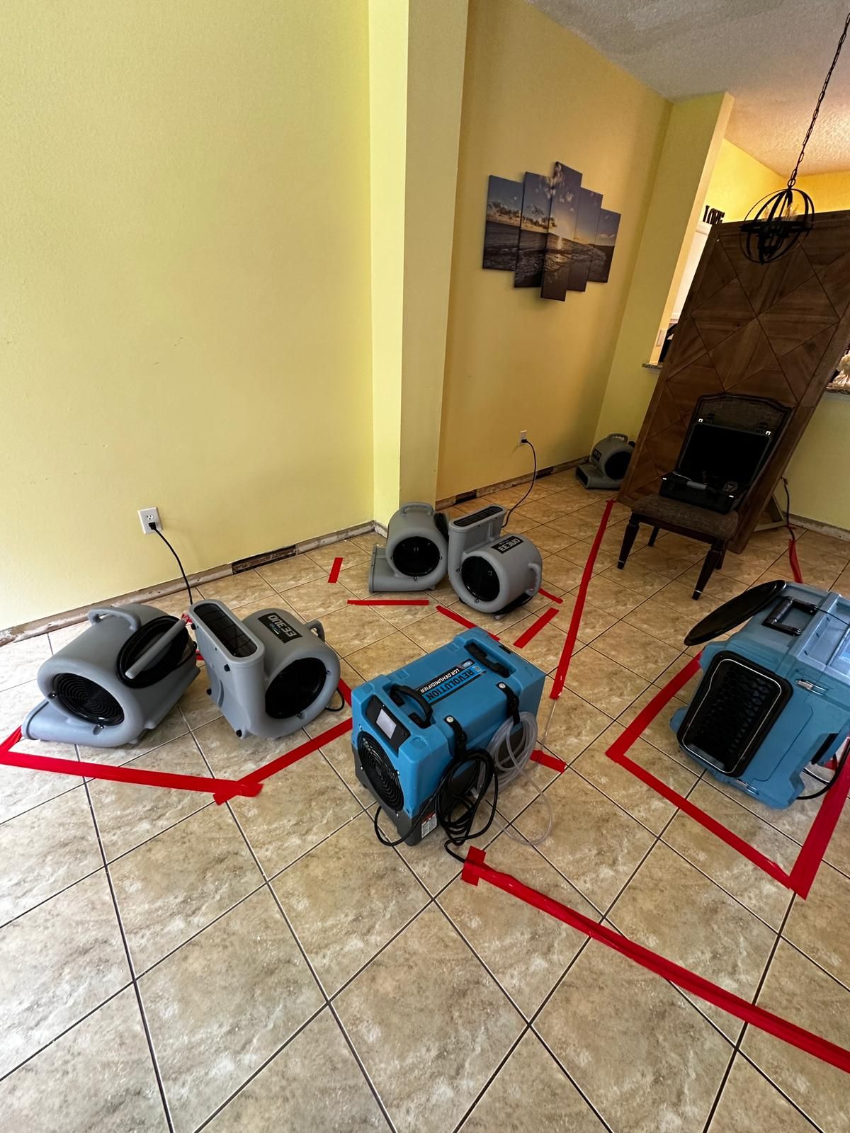 A room with a lot of appliances on the floor.