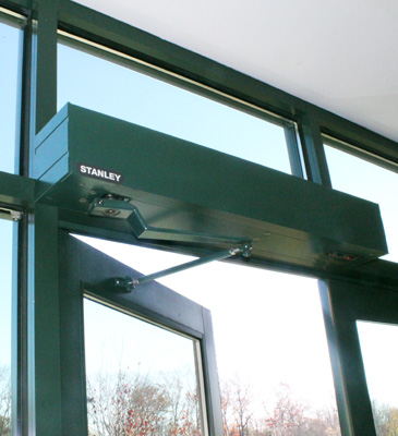 A stanley brand door opener is in a building