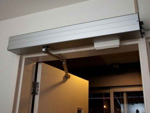 A door with a sliding door open in a room