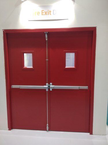 A red fire exit door with a sign above it.