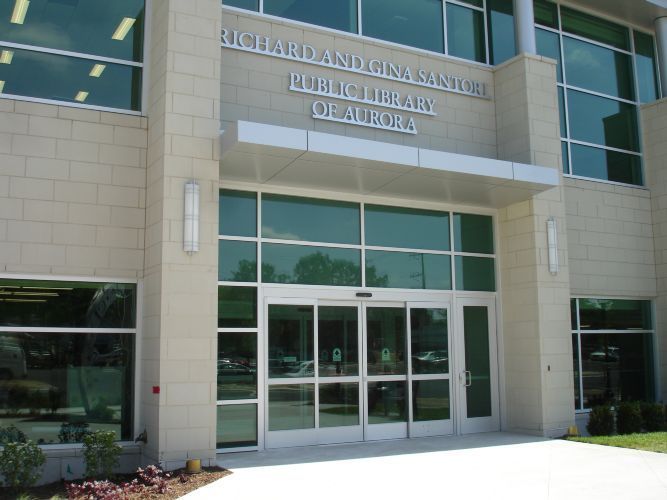 A building with a sign that says public library on it