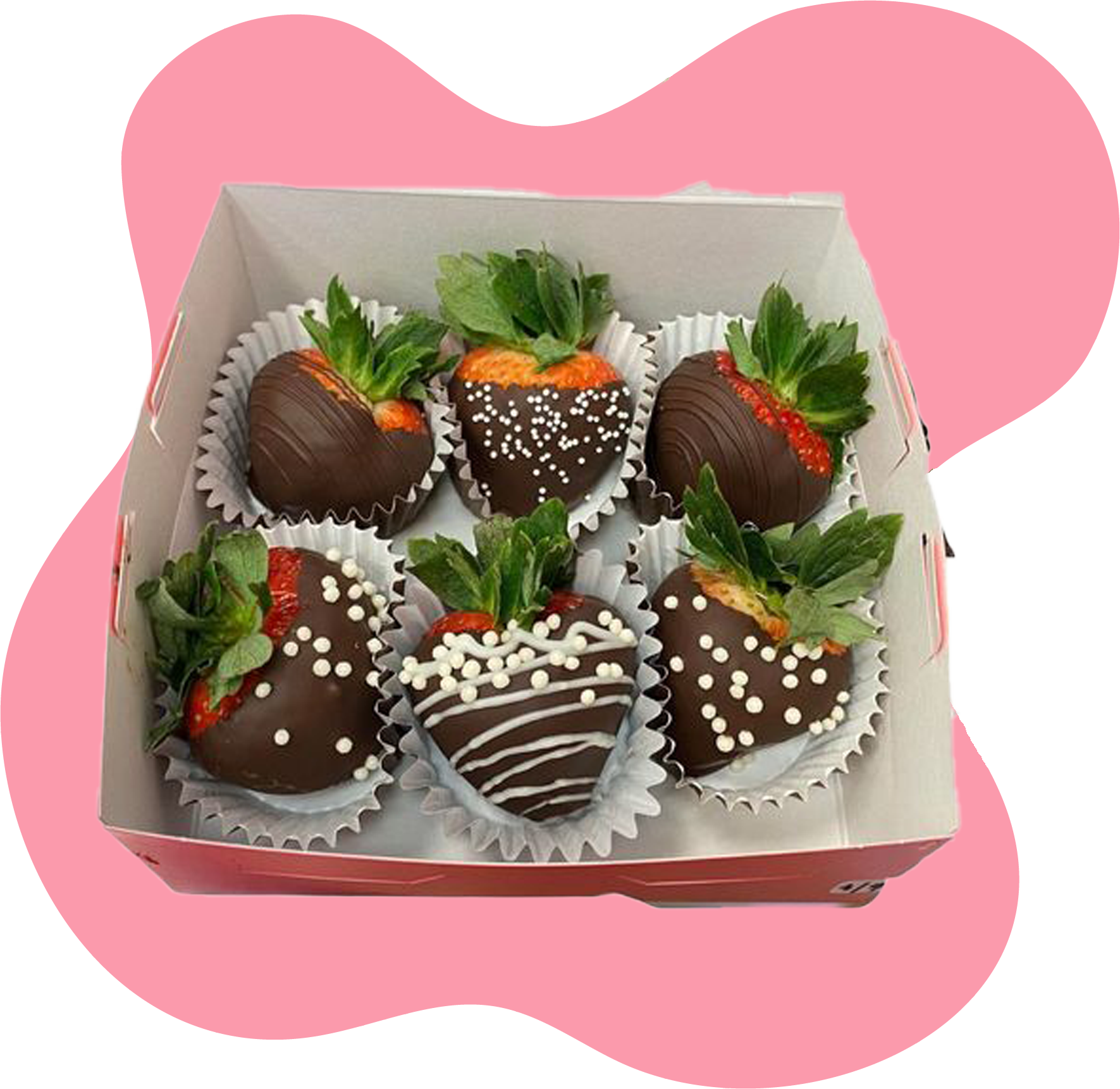 A box of chocolate covered strawberries with sprinkles on them