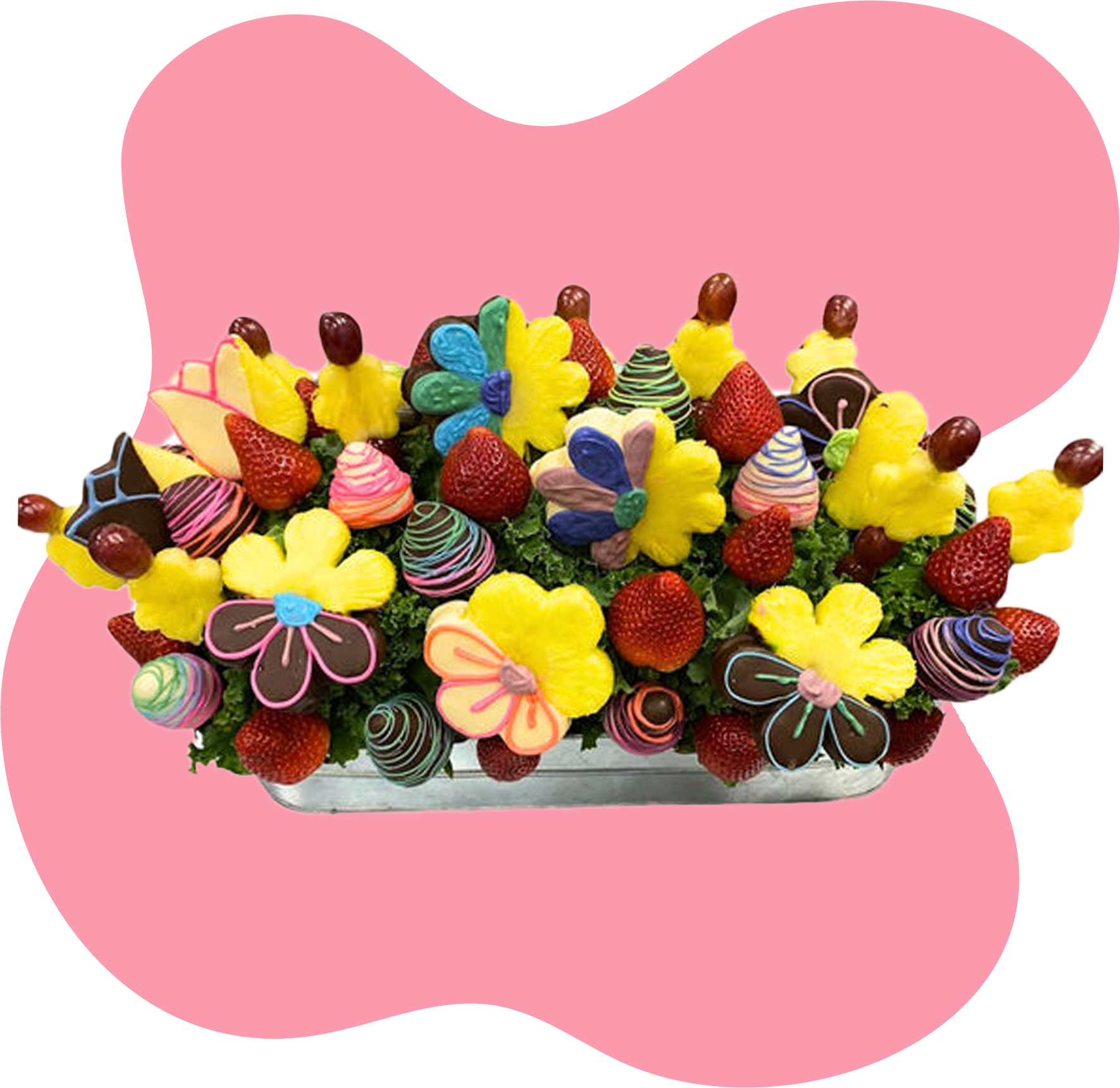 A bouquet of fruit and chocolate covered ghosts in a mug