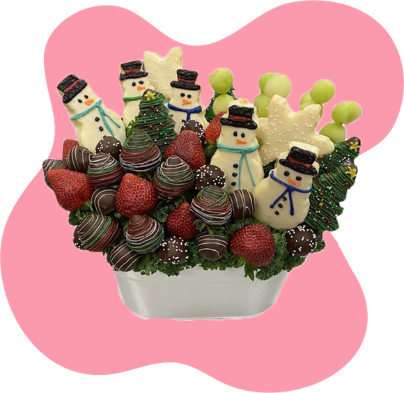 A bouquet of fruit and chocolate covered ghosts in a mug