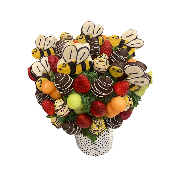 A bouquet of fruit in a bucket that says super bowl party