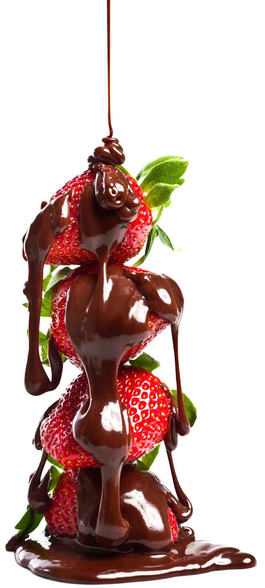 A strawberry covered in chocolate sauce on a white background