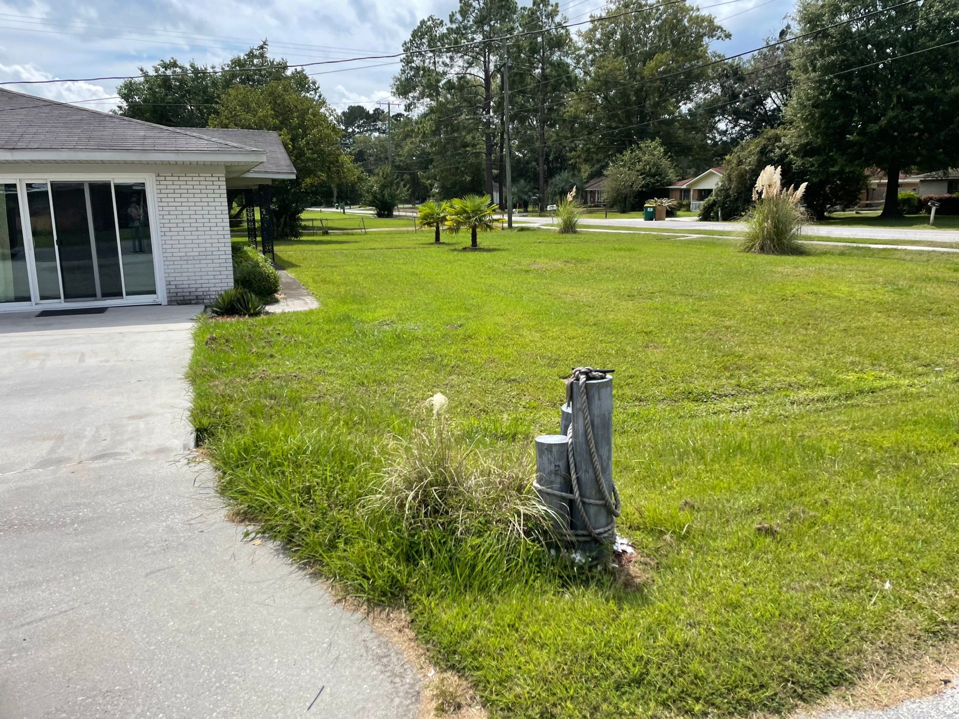 A house with a large lawn in front of it