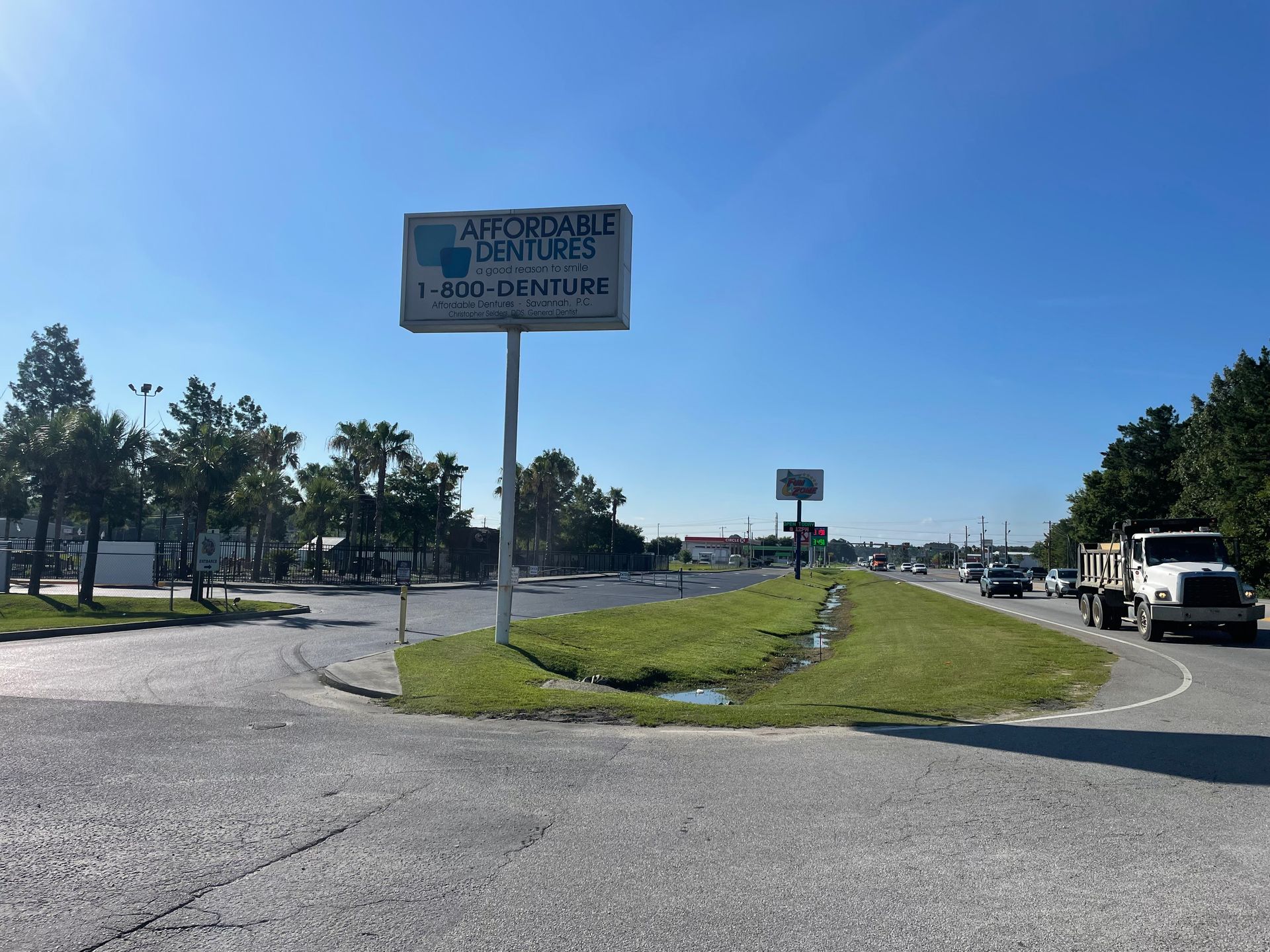 A truck is driving down a road next to a sign that says atomic centers