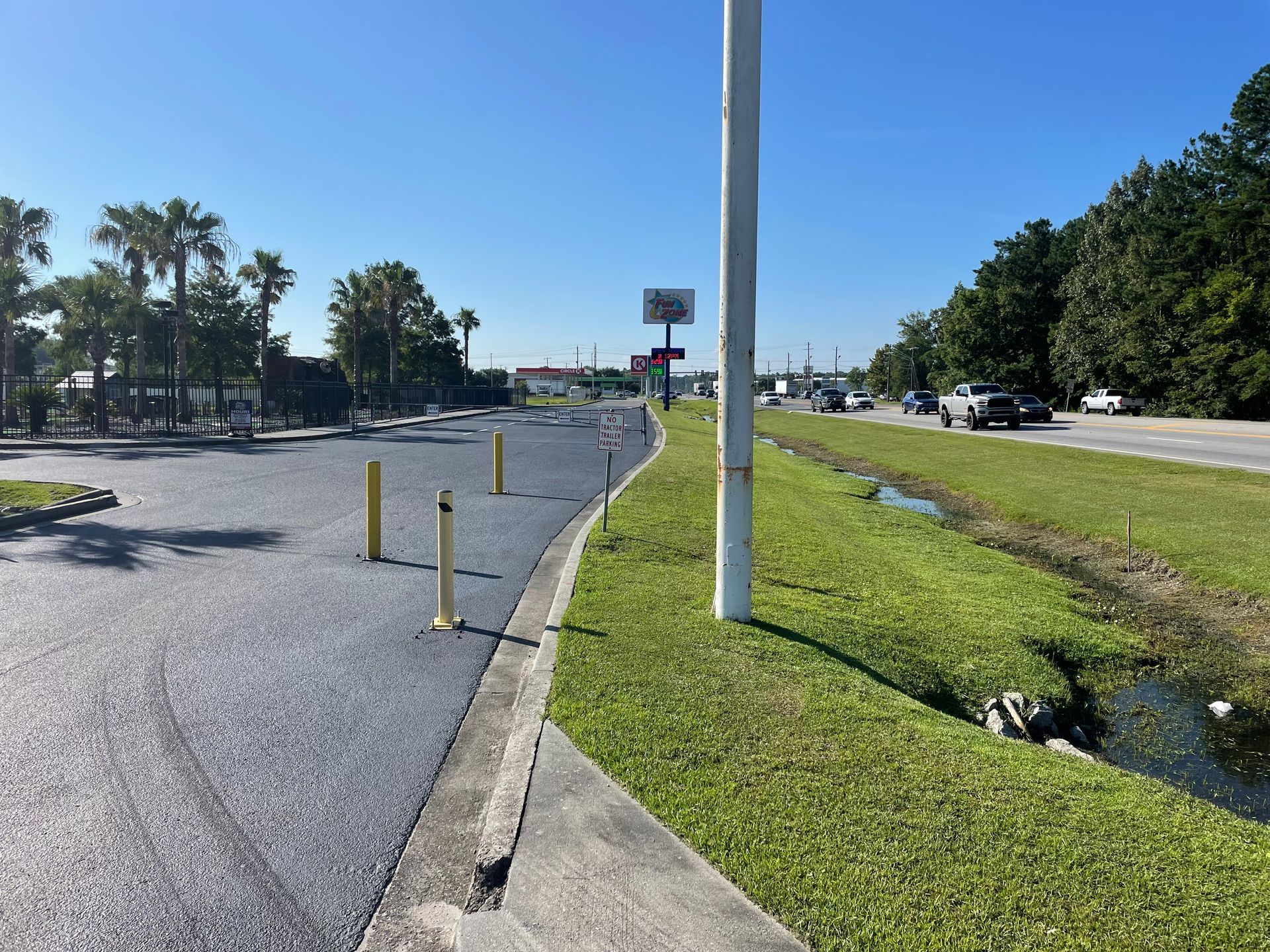 A road with a lot of grass on the side of it