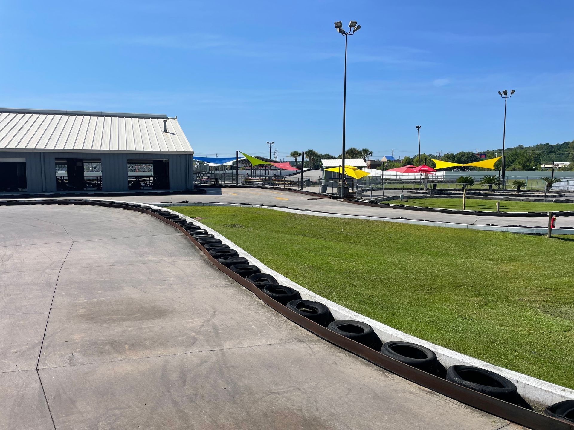 A go kart track with a building in the background