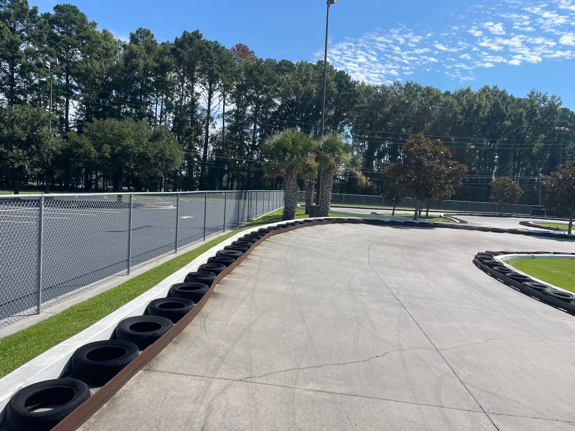 A race track with tires on the side of it