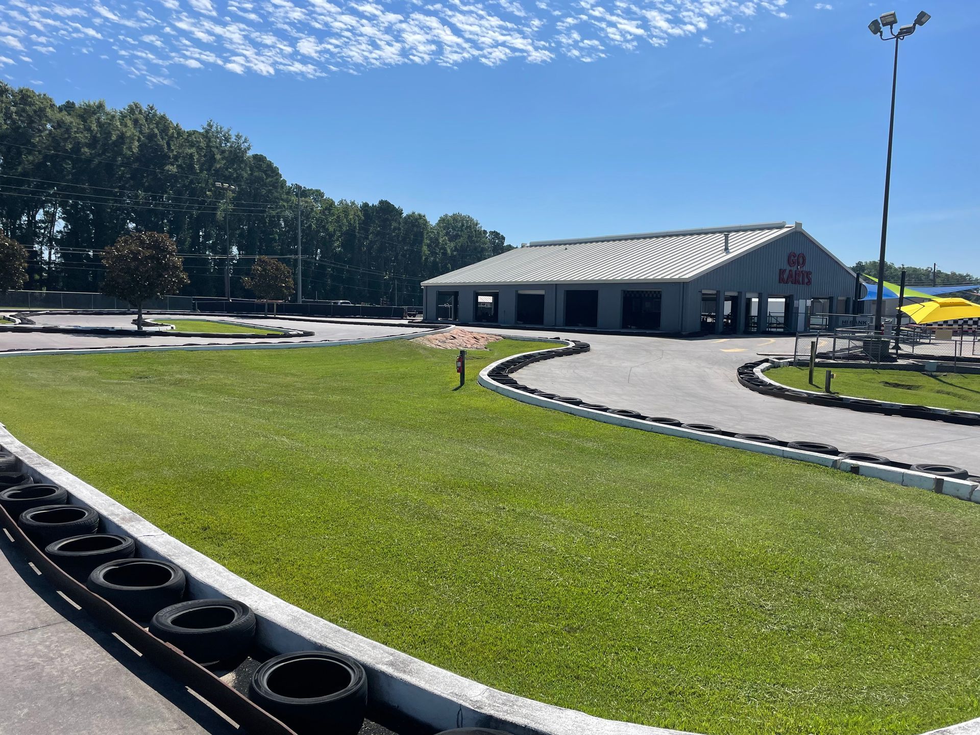 A go kart track with a building in the background