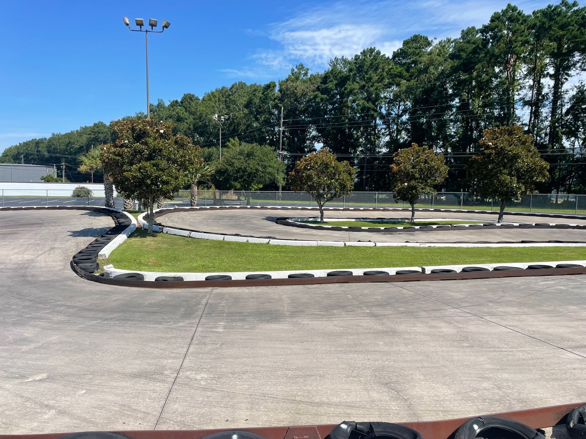 A go kart track with trees in the background