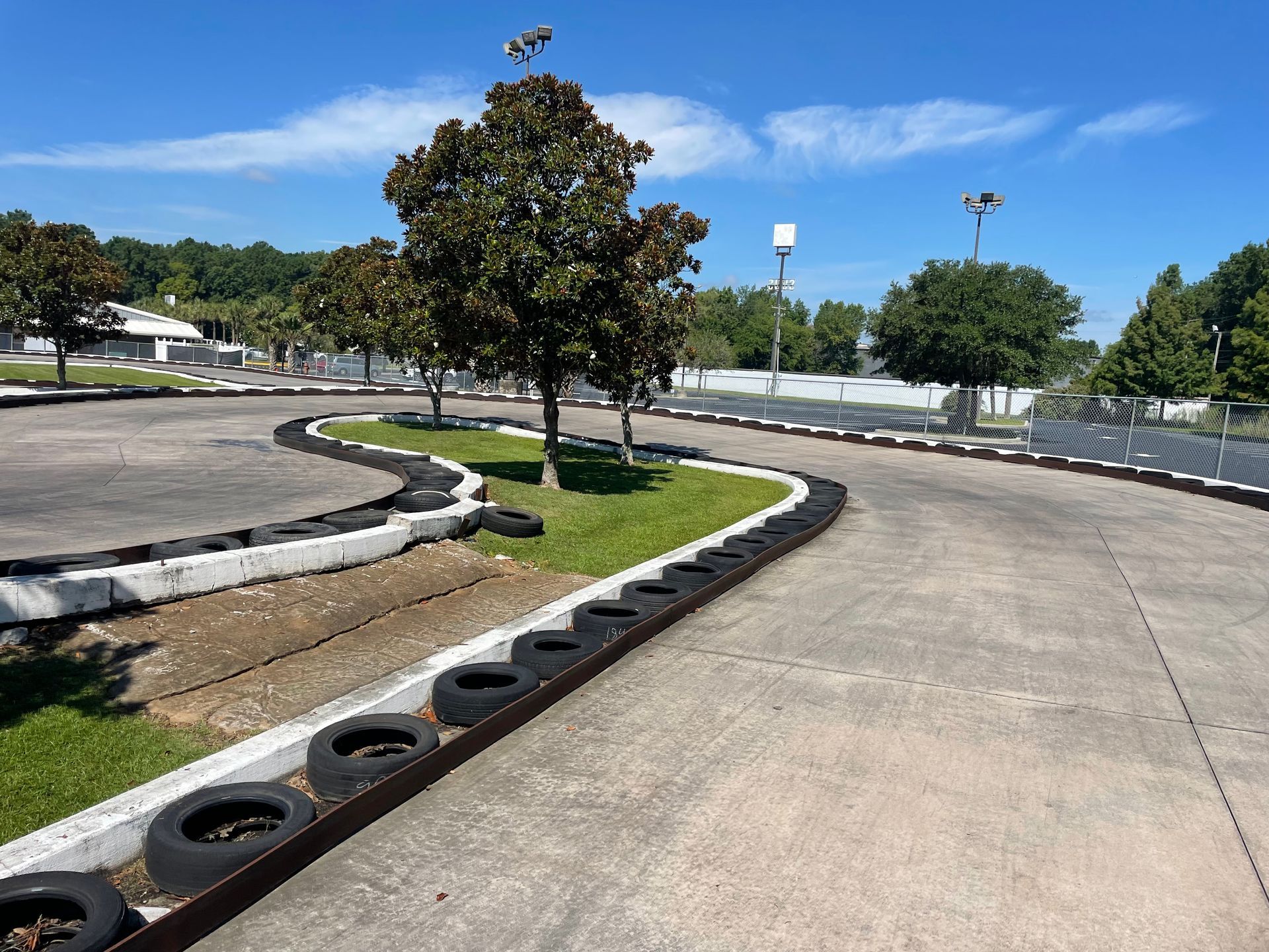 A go kart track with tires on the side of it
