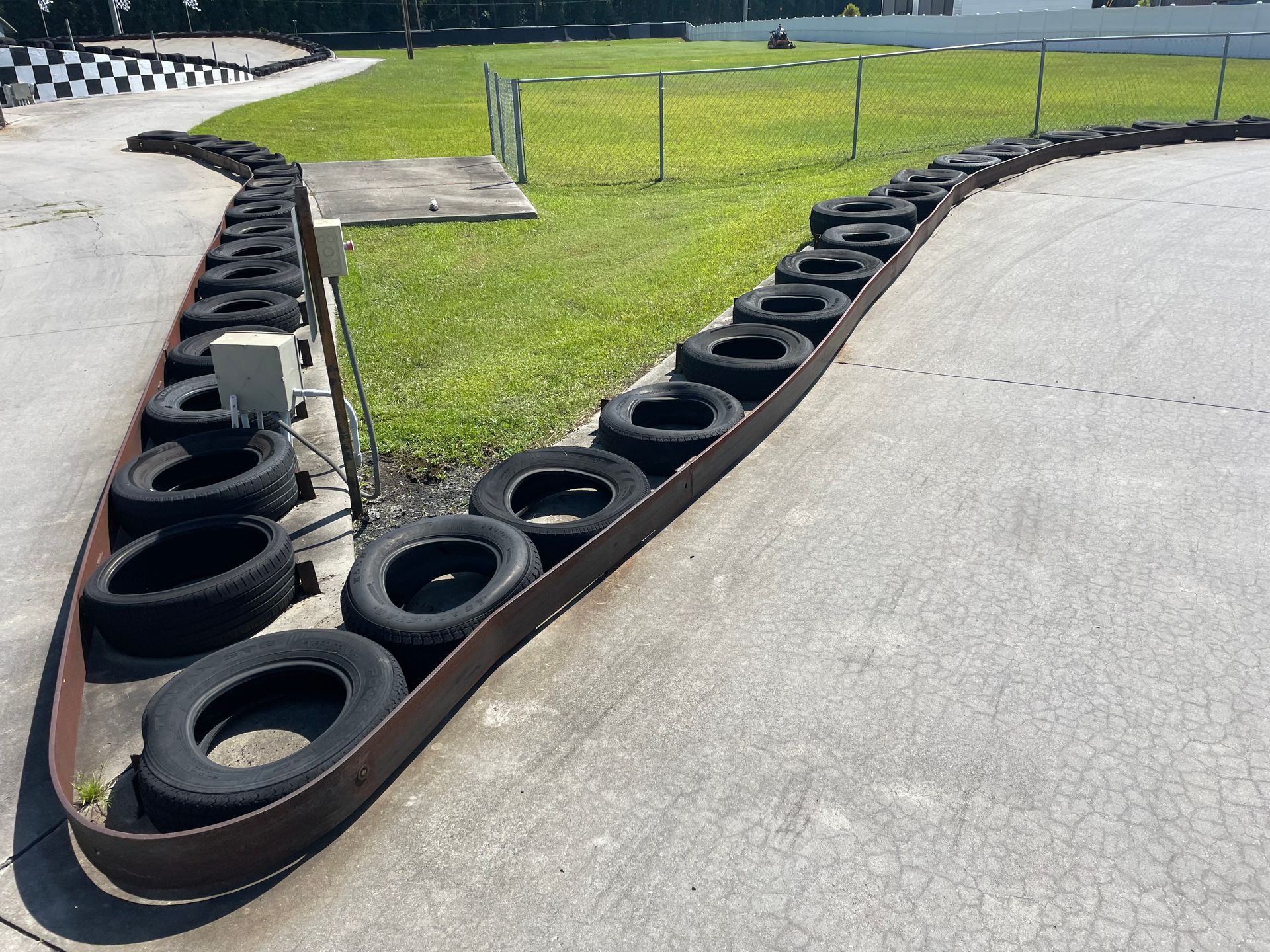 A row of tires on the side of a road