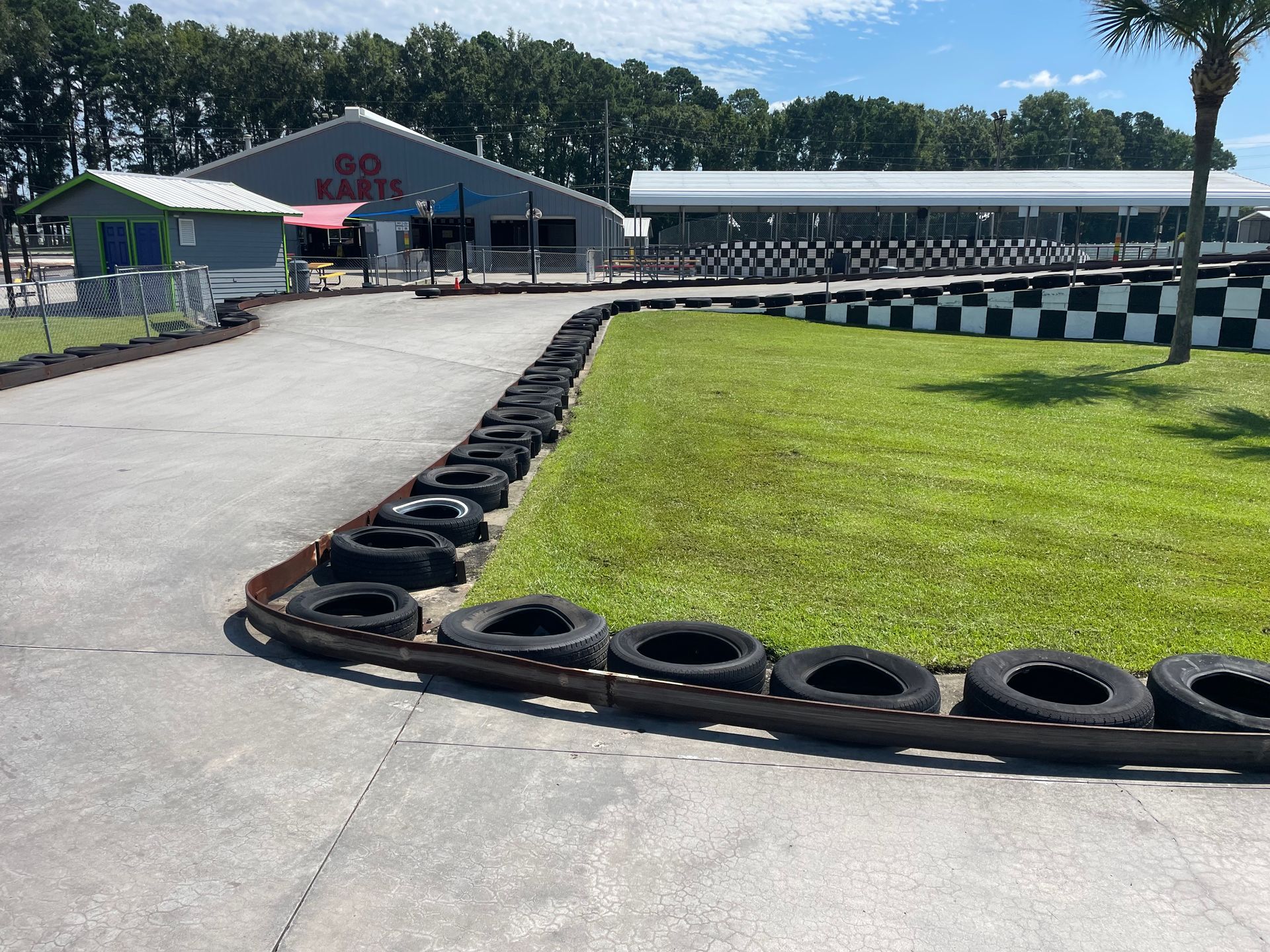 A go kart track with tires on the side of it