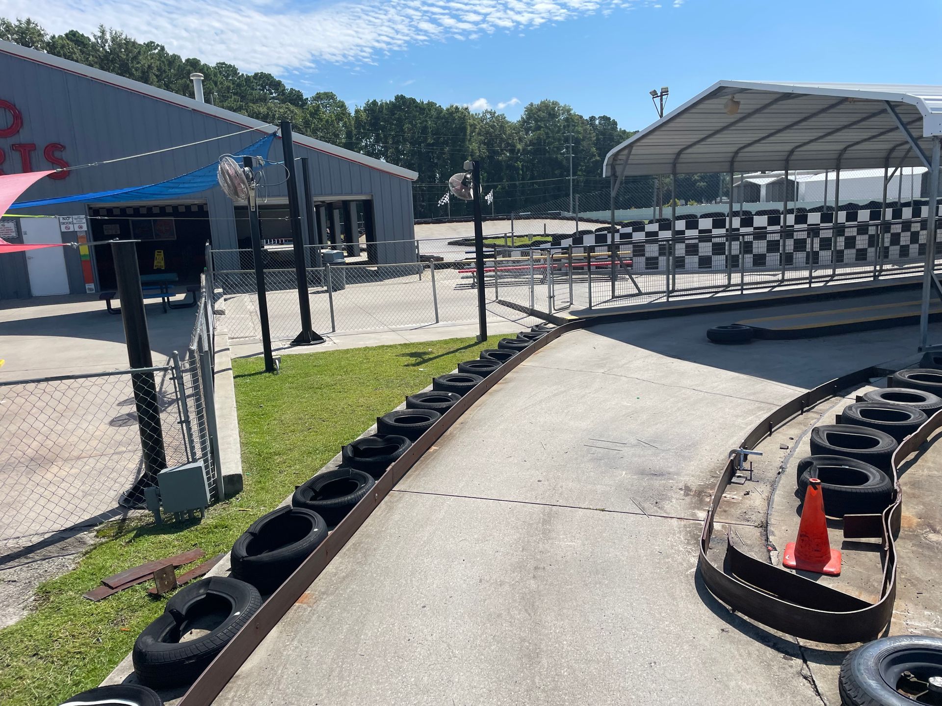 A go kart track with tires and cones on it