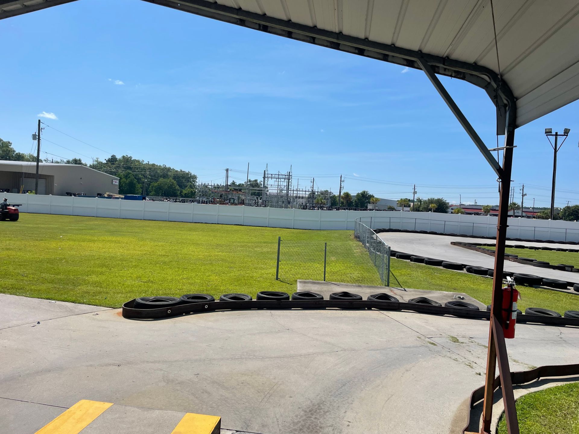 A view of a go kart track from under a canopy