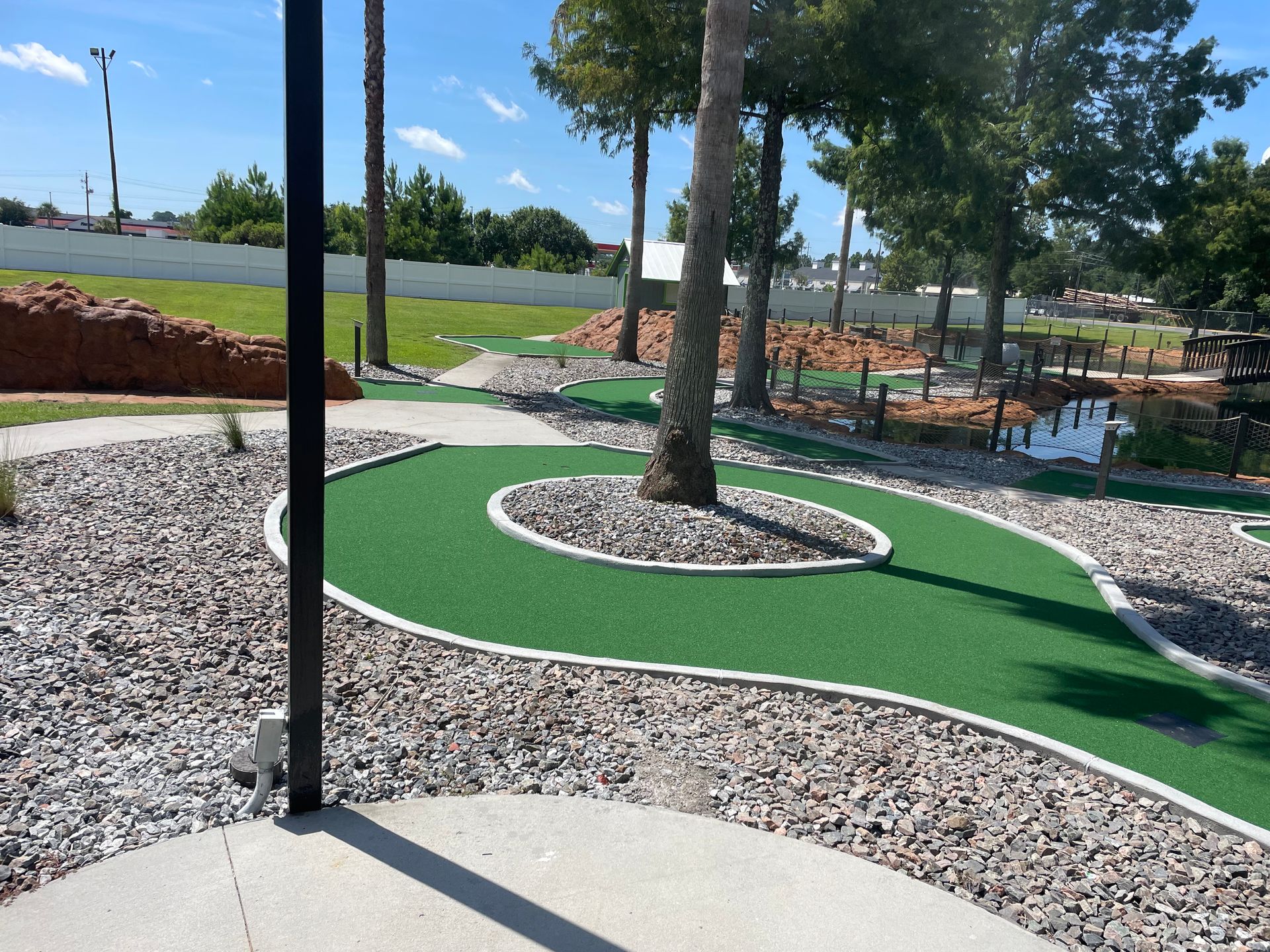 A golf course with a few trees in the background