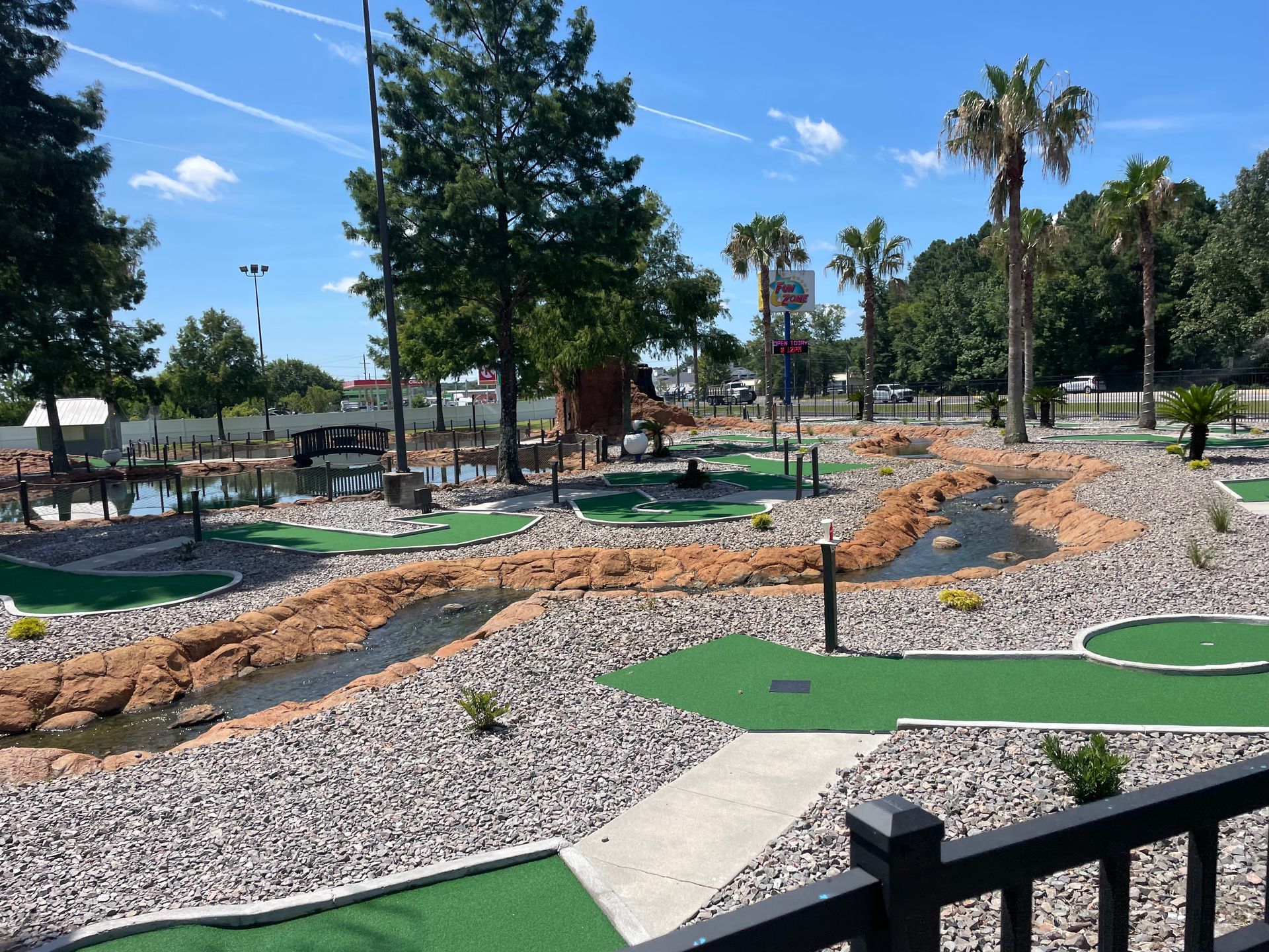 A view of a mini golf course from a balcony.