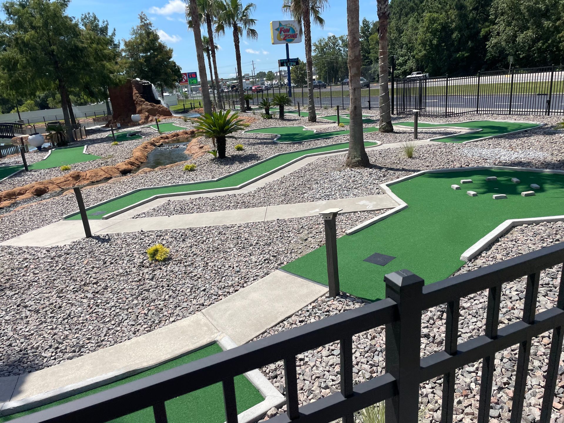 A view of a mini golf course from a balcony