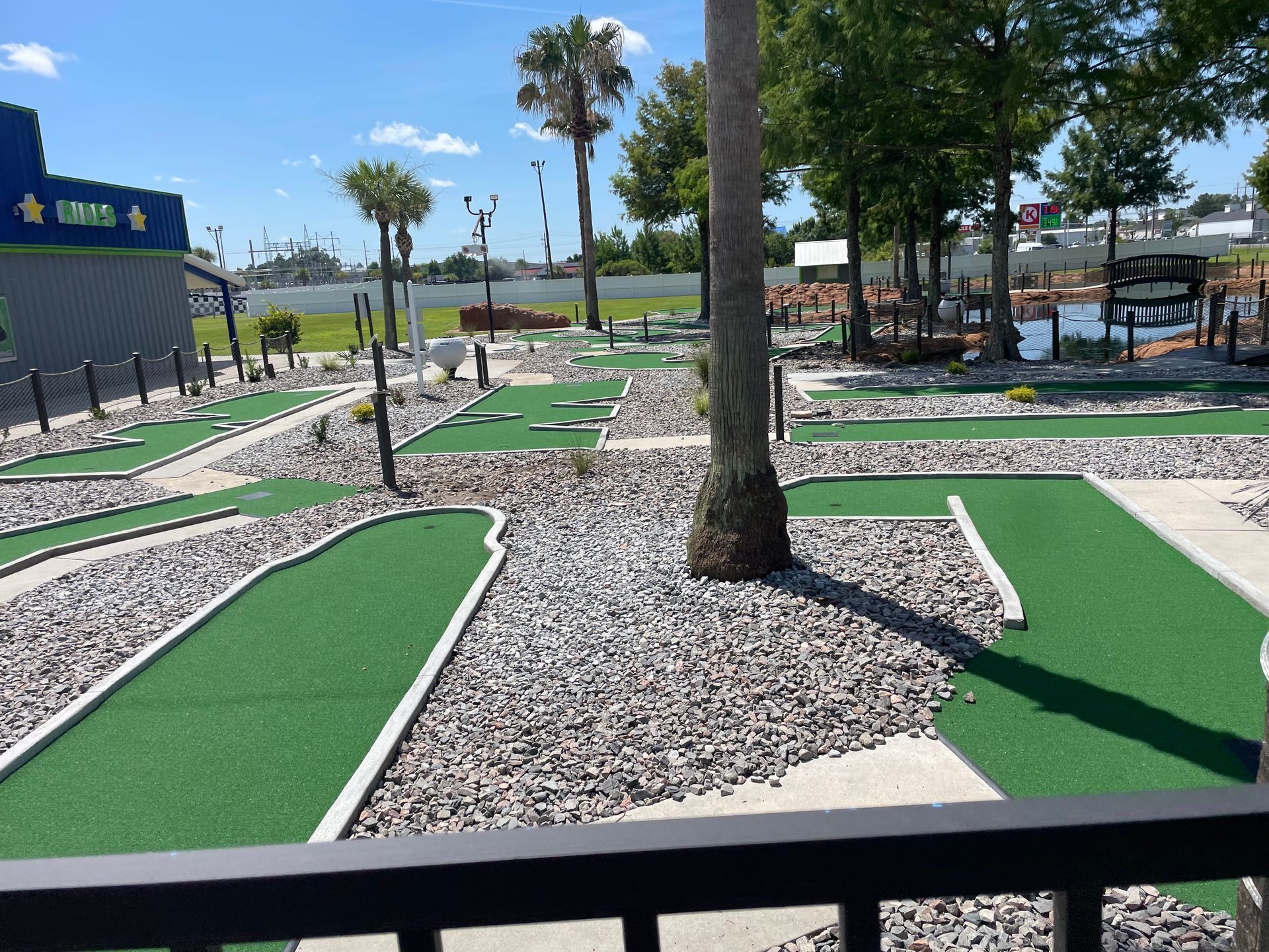 A view of a mini golf course from a balcony