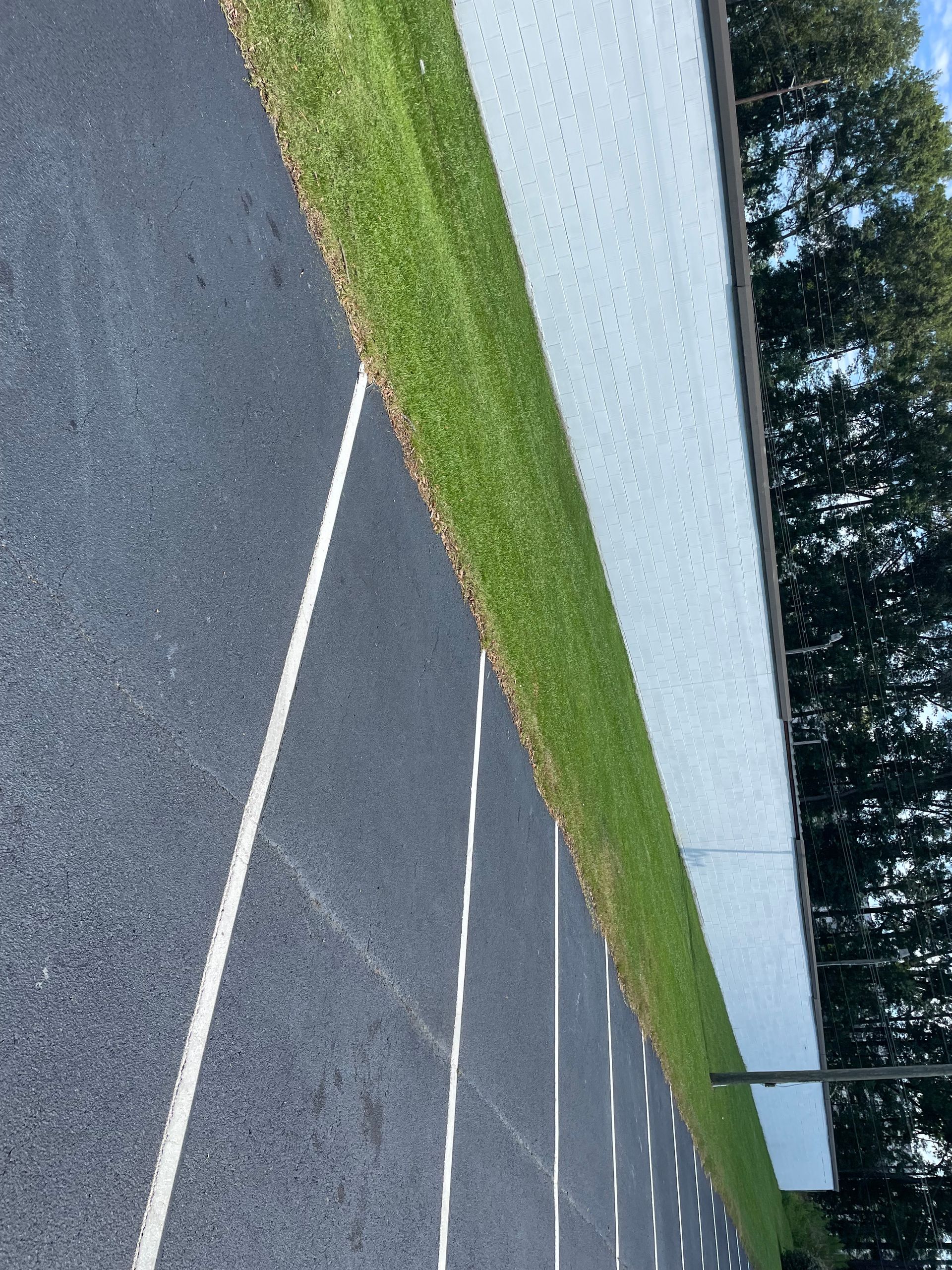 A road with a white line on the side of it