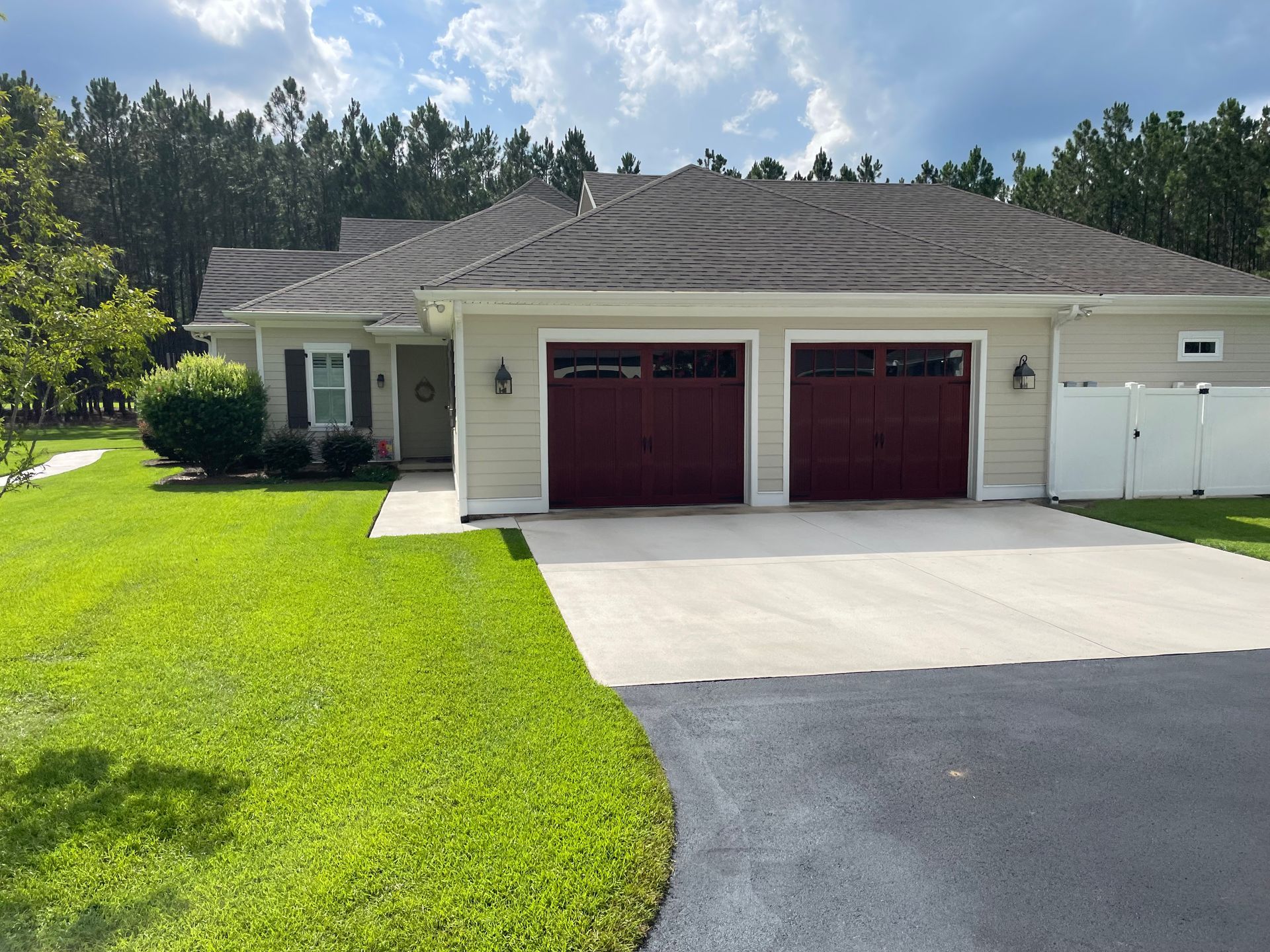 A house with two garage doors and a driveway