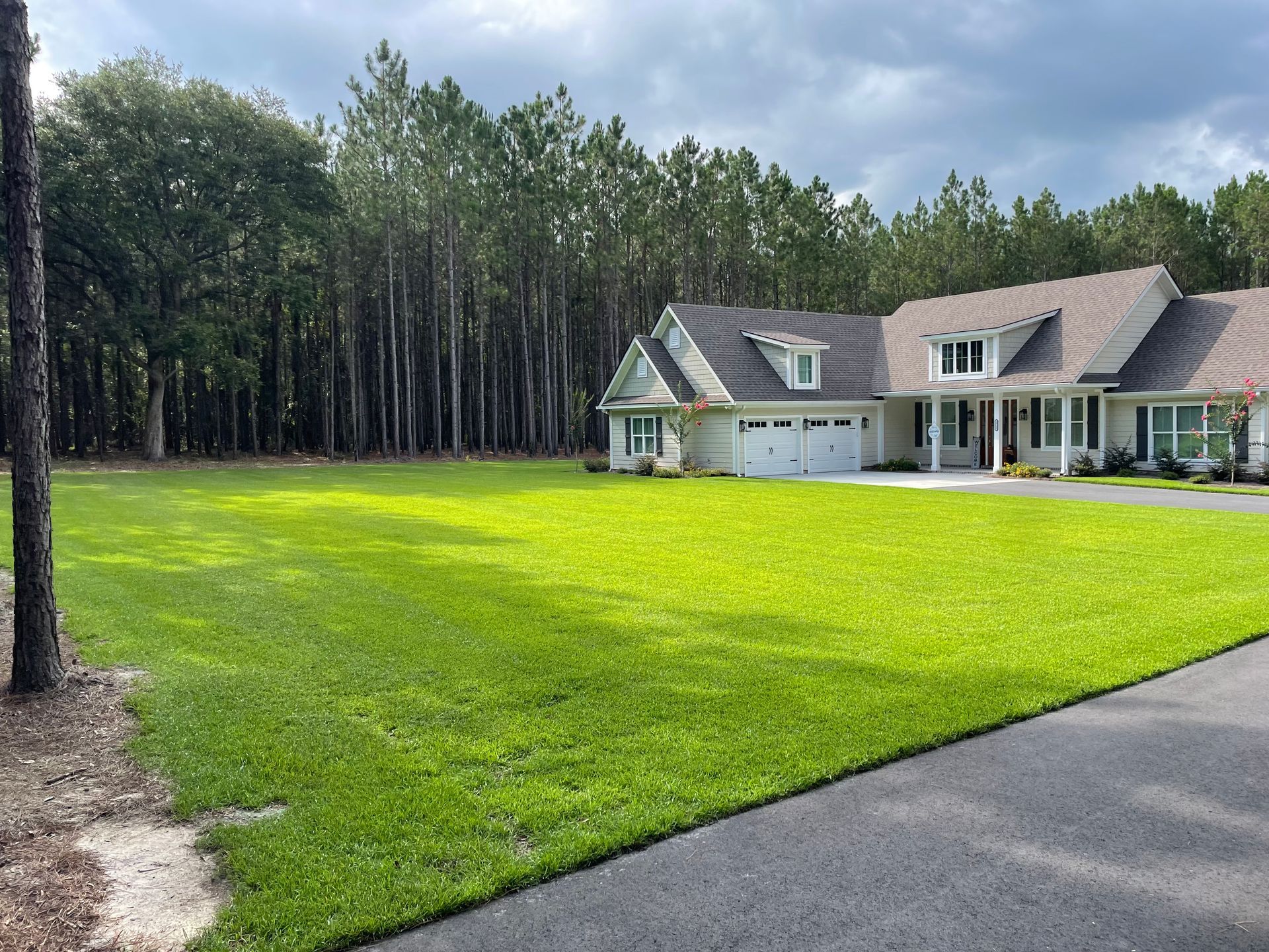 A large house with a large lawn in front of it