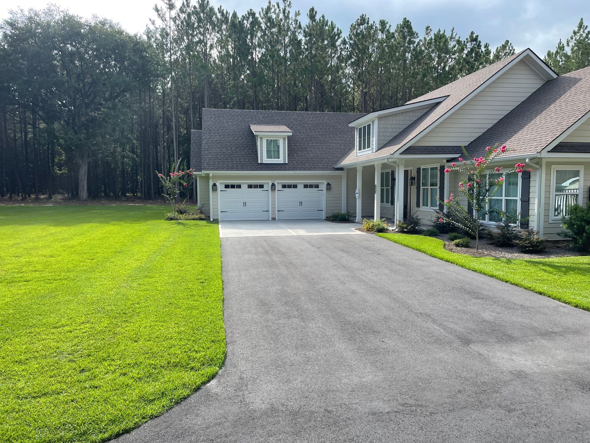 A large house with a driveway leading to it