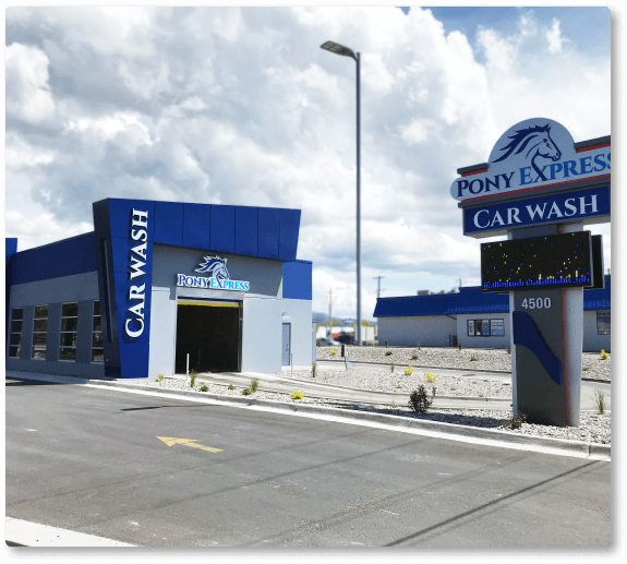 A car wash with a sign that says pony express car wash