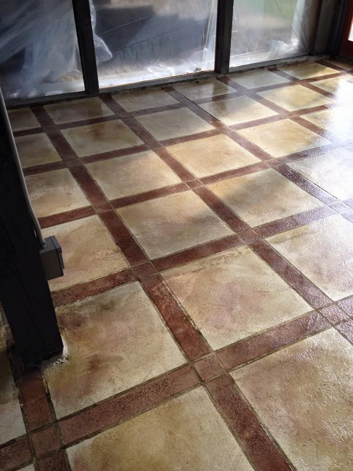 Brown and tan checkered concrete floor.