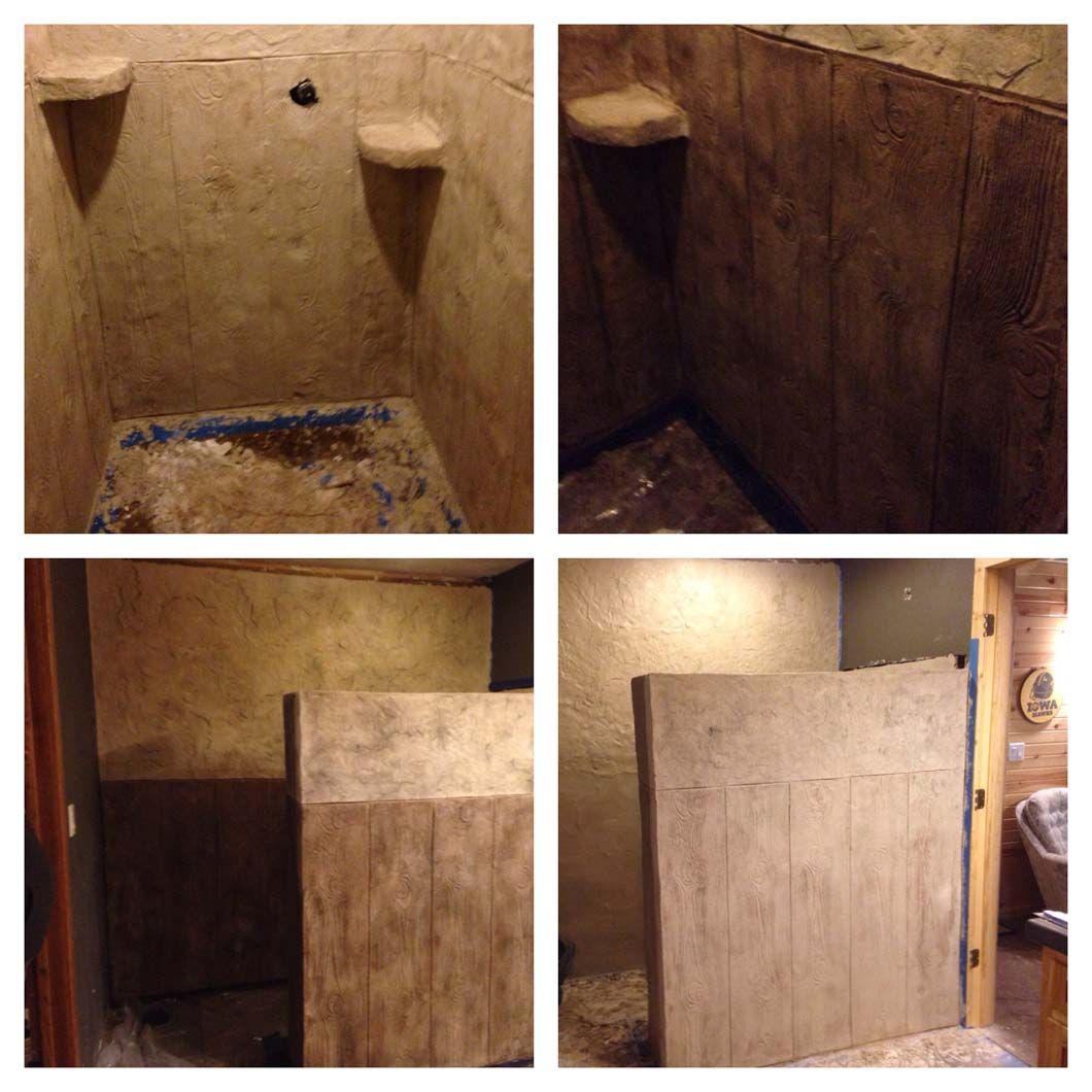 Shower renovation in progress, featuring rough, textured walls, built-in shelves, and a partially constructed barrier.