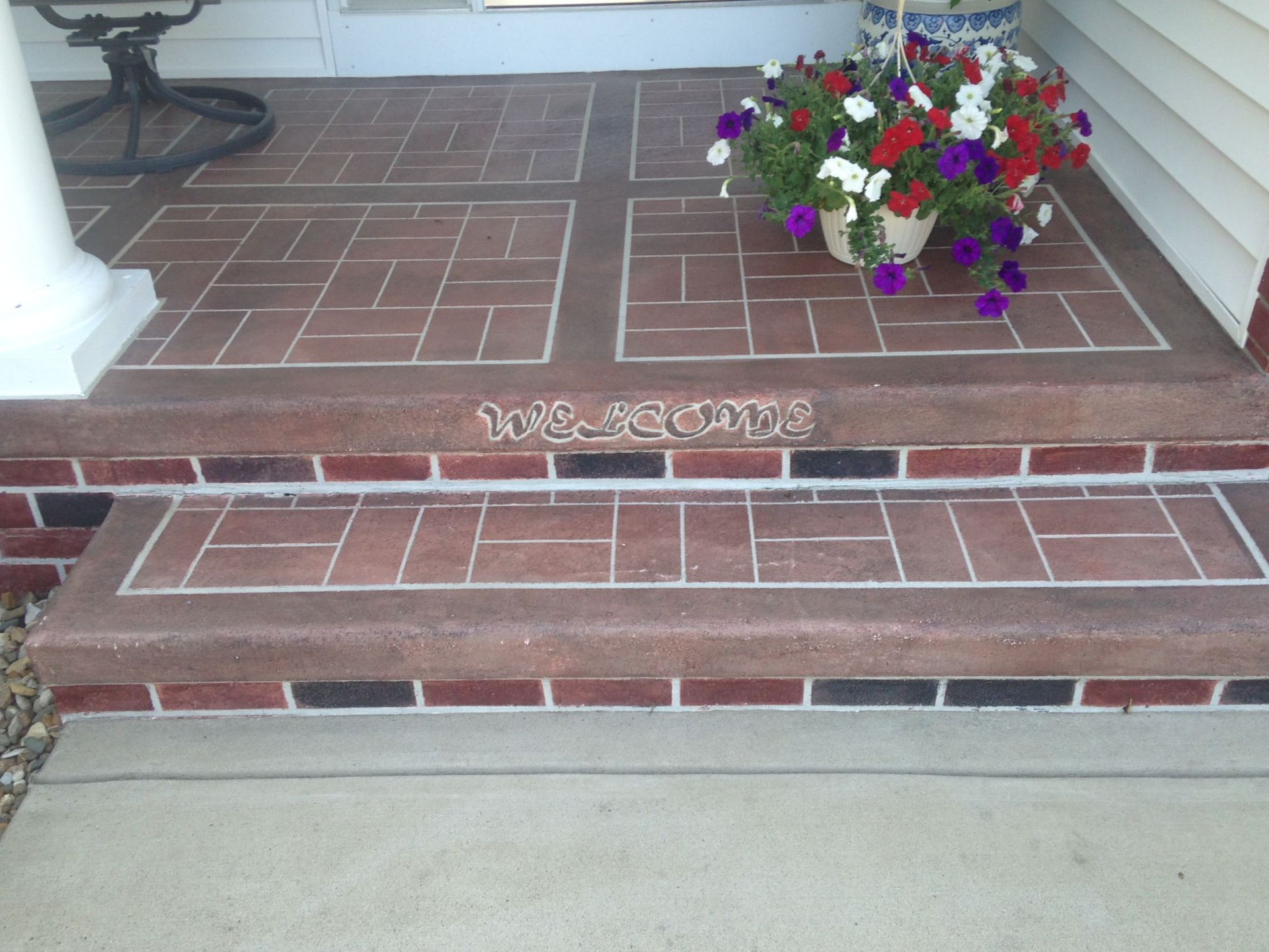Brick-patterned porch and steps with