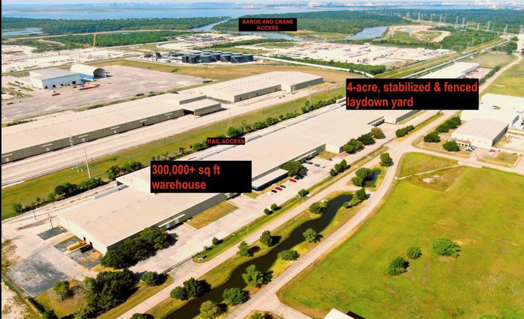 Aerial view of an industrial complex with warehouses, a laydown yard, and buildings.