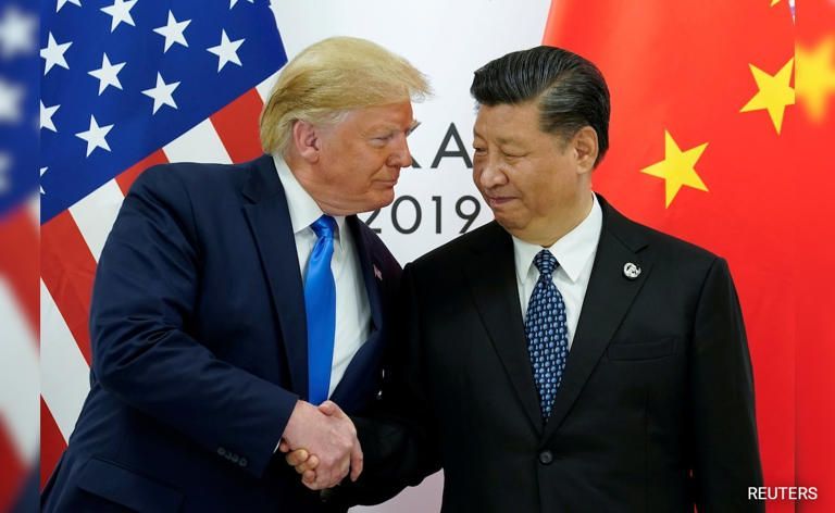Donald Trump and Xi Jinping shaking hands; American and Chinese flags in background.