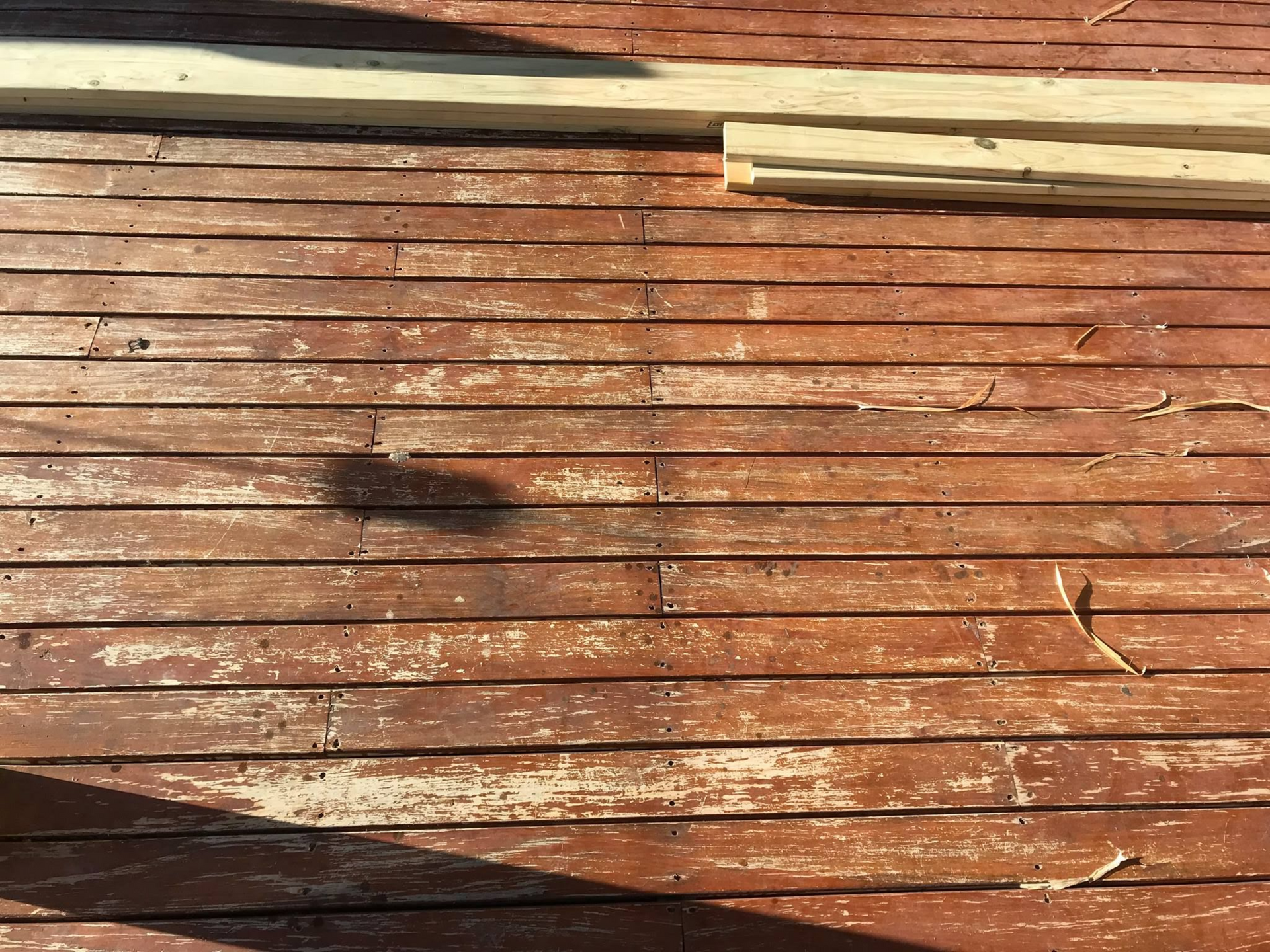Weathered Wooden Fence With Peeling Brown Paint — Custom Floor Sanding In Somersby, NSW