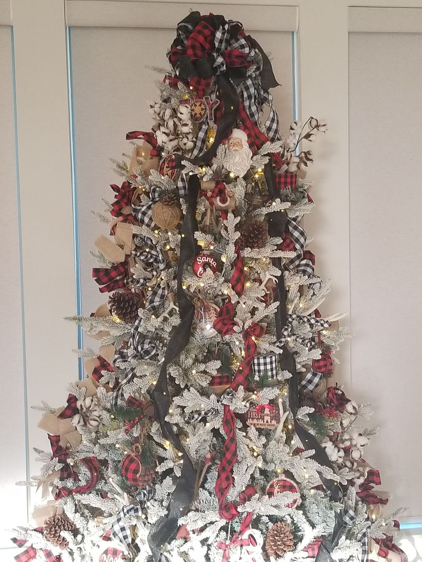 A Christmas tree with red and white decorations