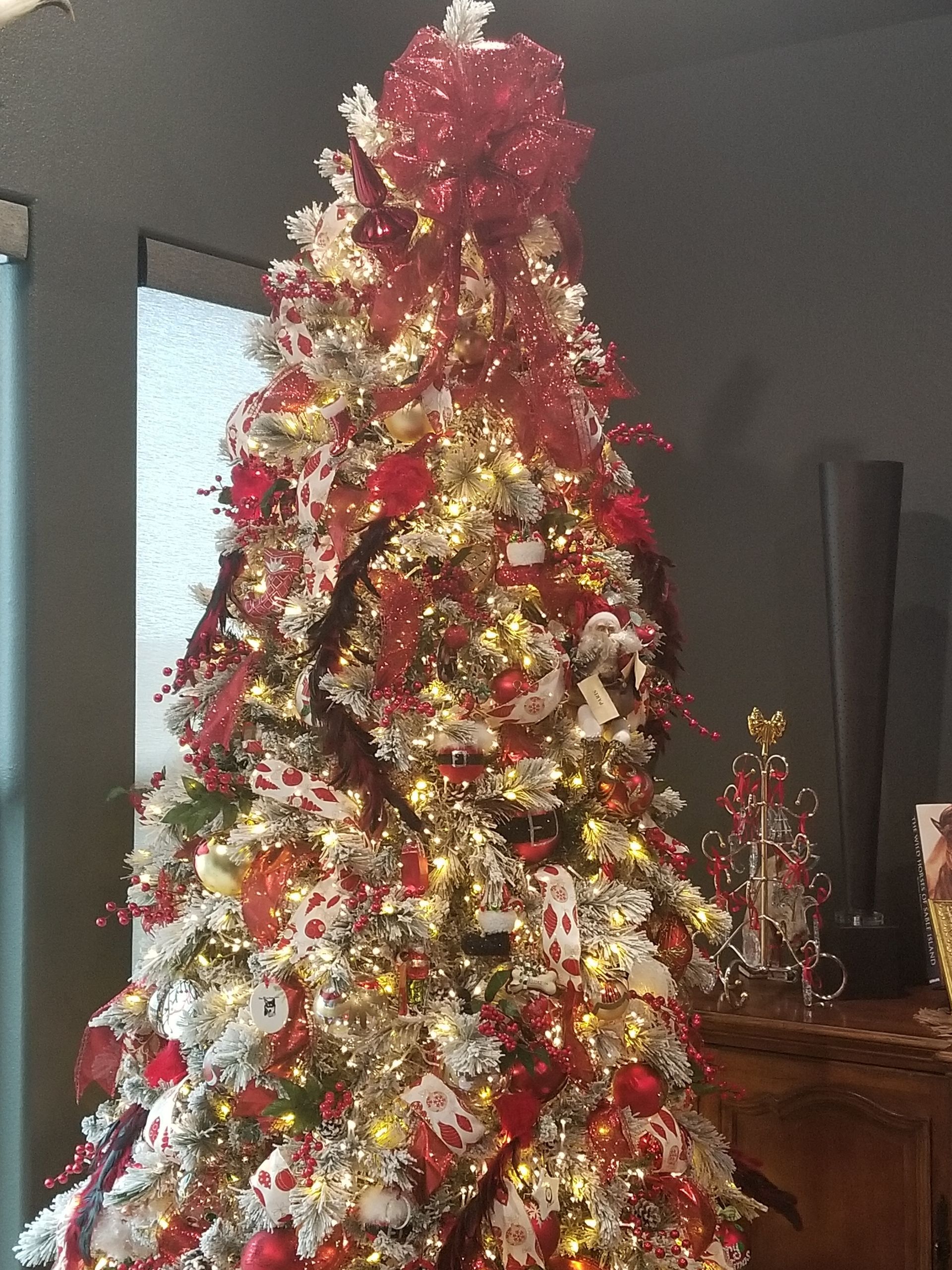 A Christmas tree with red and white decorations