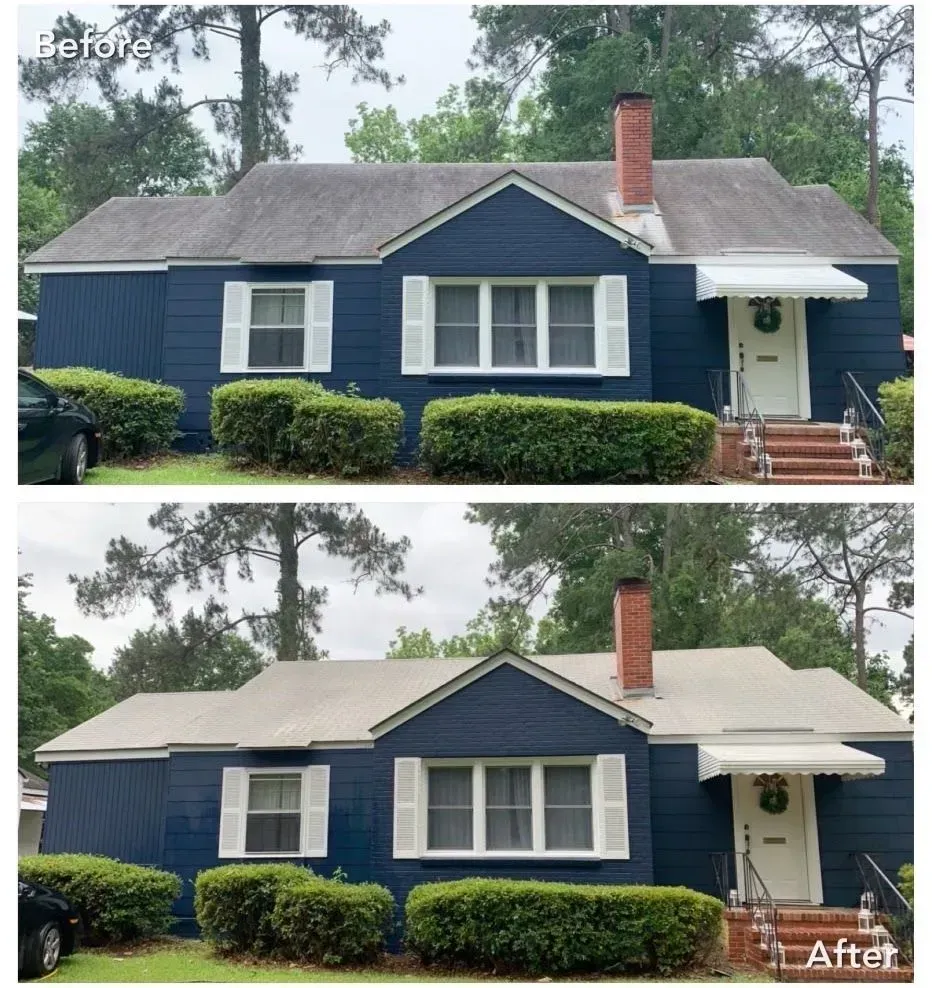 Comparison of a blue house before and after a roof cleaning.