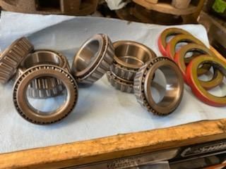 a bunch of bearings are sitting on top of a wooden table .