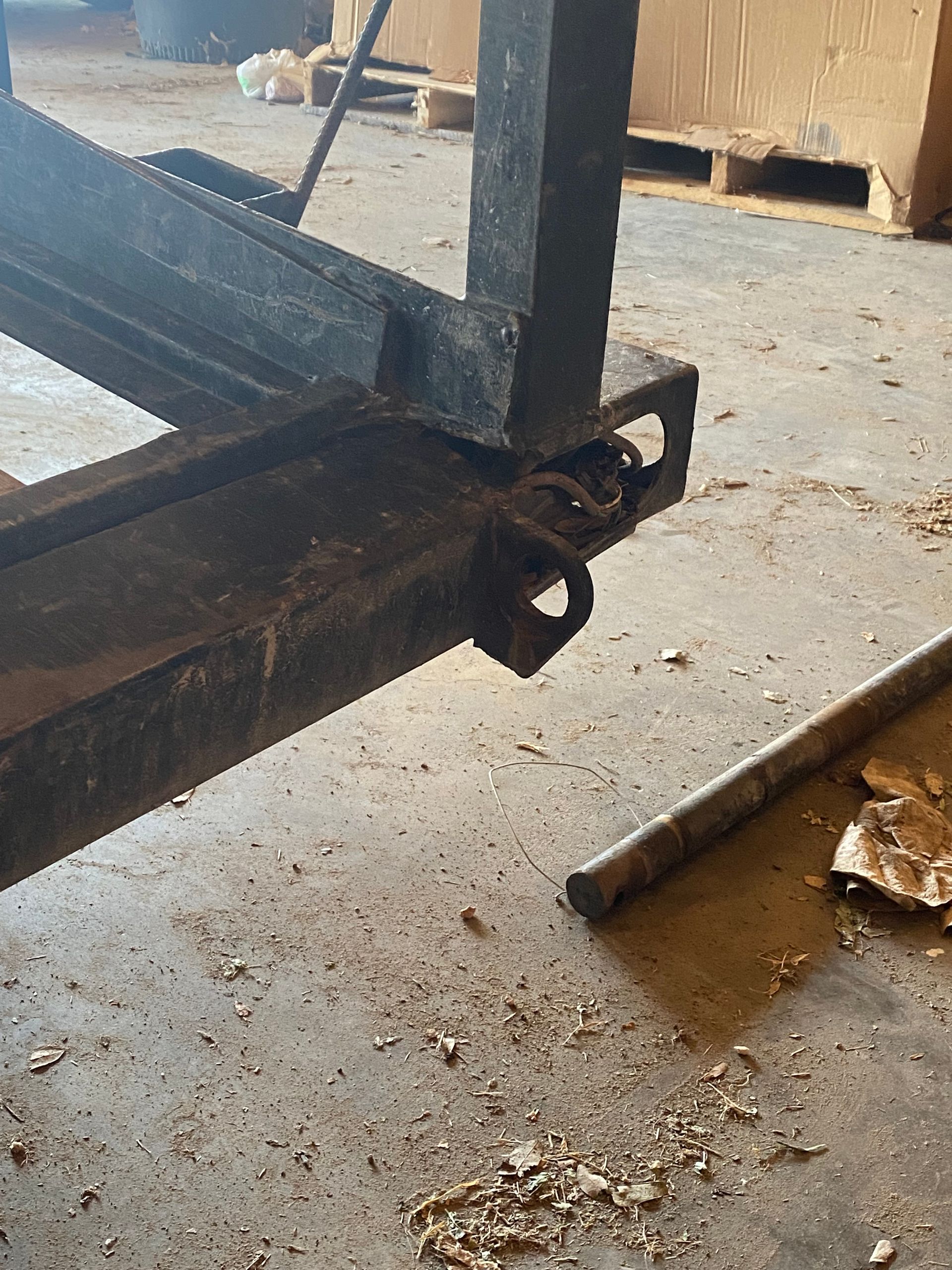 a forklift is sitting on the ground in a garage .