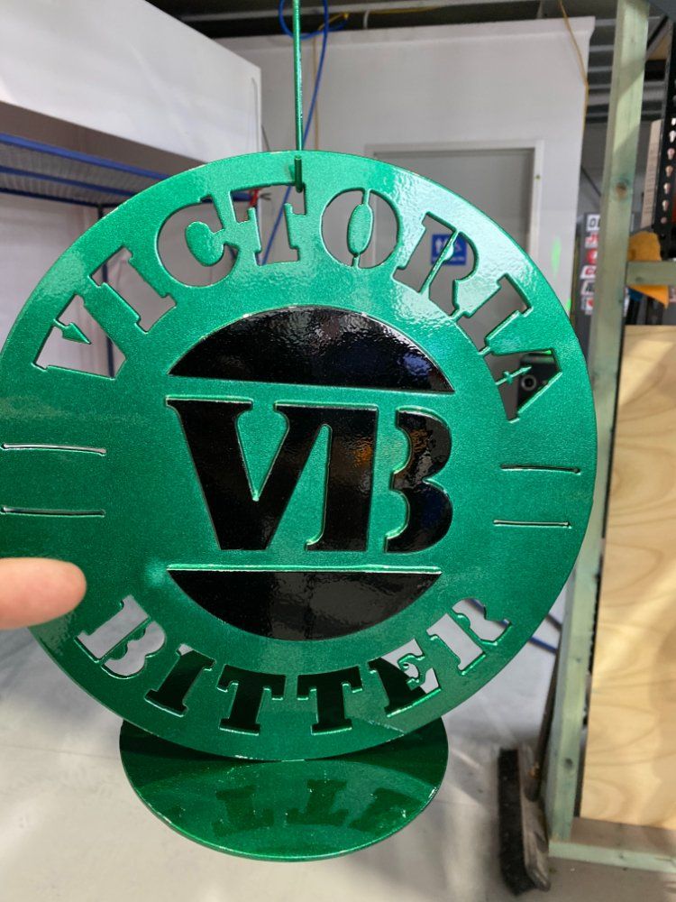 VB Bitter Logo On Green Metal — Protective Coating in Cameron Park, NSW