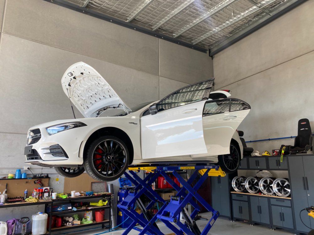 Lifted White Car — Protective Coating in Cameron Park, NSW