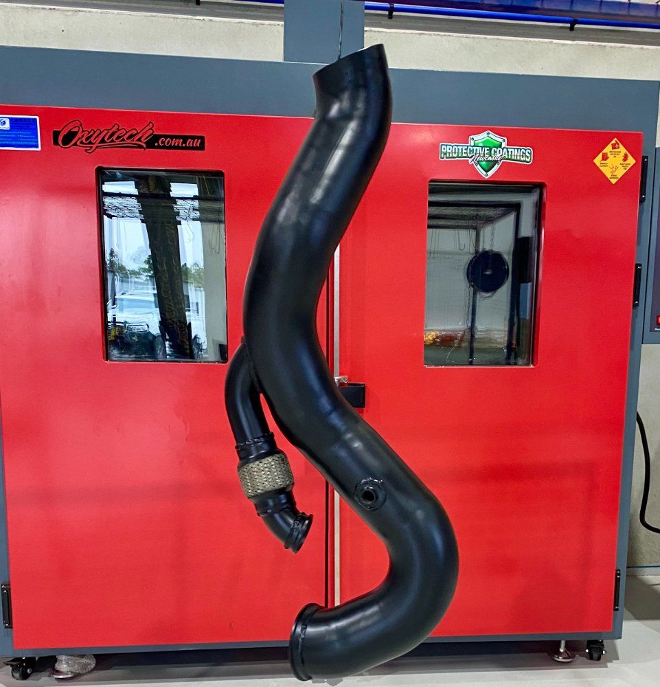 Hanging Black Powder Coated Pipe — Protective Coating in Cameron Park, NSW