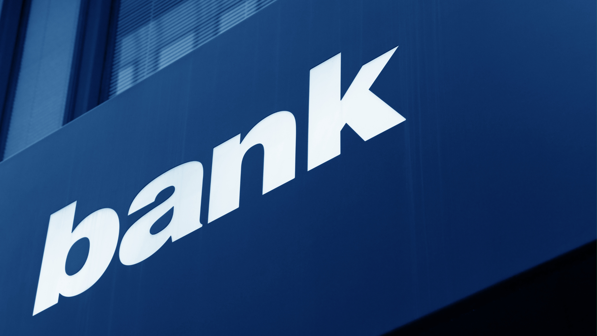 A white, bold, sans-serif sign spelling 